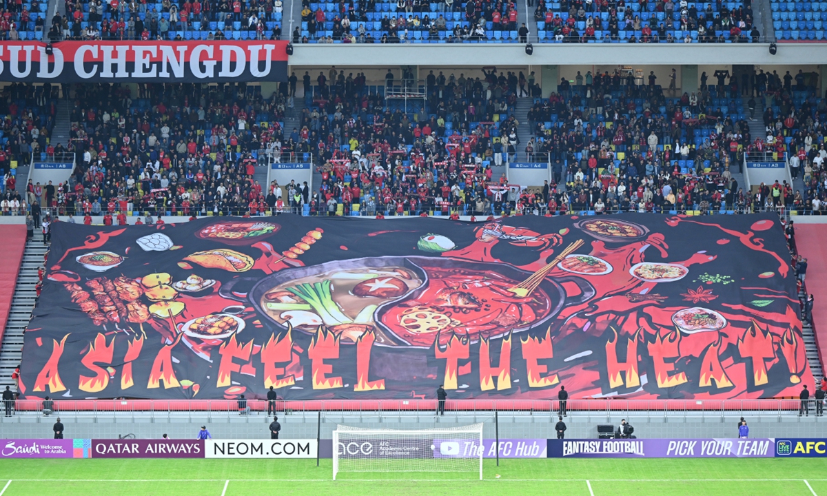 Fans of Chengdu Rongcheng display a huge  tai chi hotpot TIFO with the message 