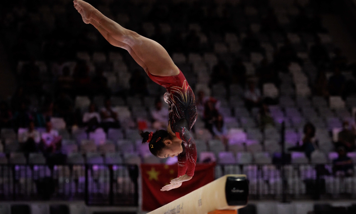 Zhang Qingying competes on the balance beam during the women's qualifying session at the 53rd FIG Artistic Gymnastics World Championships in Jakarta on October 21, 2025.  Photo: VCG