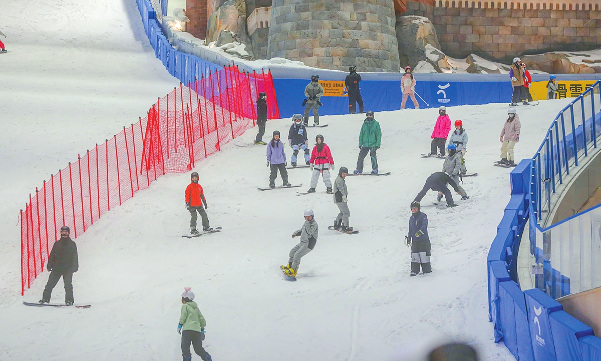 Ski enthusiasts enjoy their time at an indoor snow center in Shanghai. Photos on this page: IC 