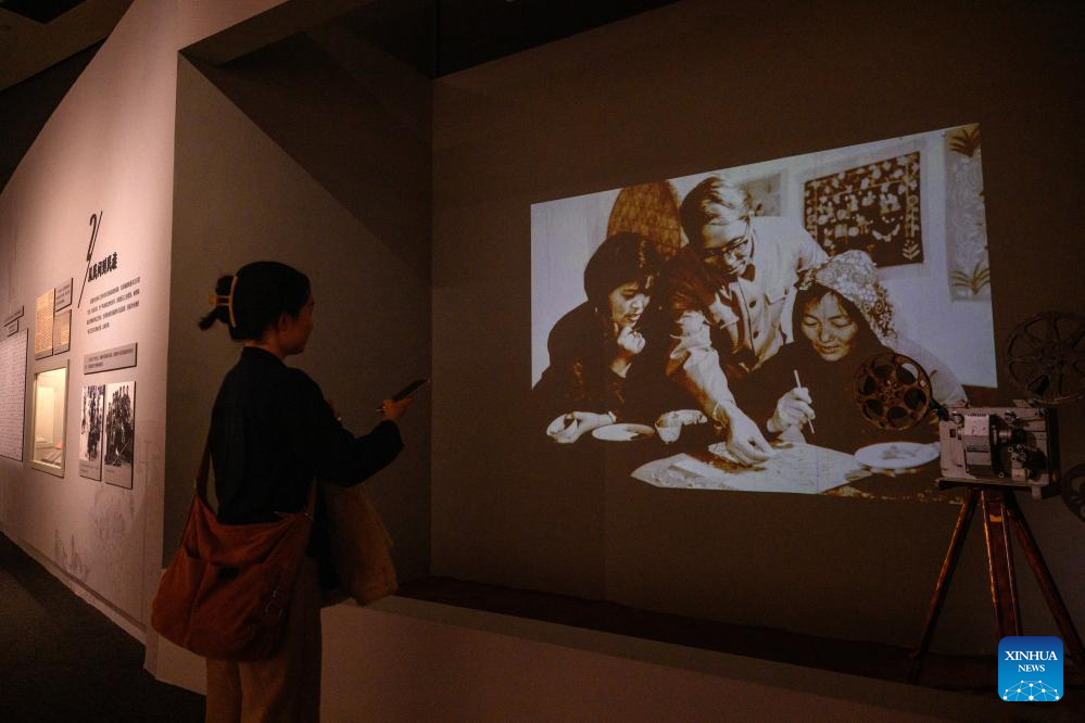 A woman visits the Colorful Brushstrokes upon the Earth: the 2025 Chinese Farmers' Paintings Exhibition at the National Museum of China in Beijing, capital of China, Oct. 28, 2025. The exhibition opened here on Tuesday. (Xinhua/Jin Liangkuai)