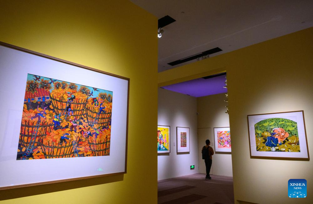 A man visits the Colorful Brushstrokes upon the Earth: the 2025 Chinese Farmers' Paintings Exhibition at the National Museum of China in Beijing, capital of China, Oct. 28, 2025. The exhibition opened here on Tuesday. (Xinhua/Jin Liangkuai)