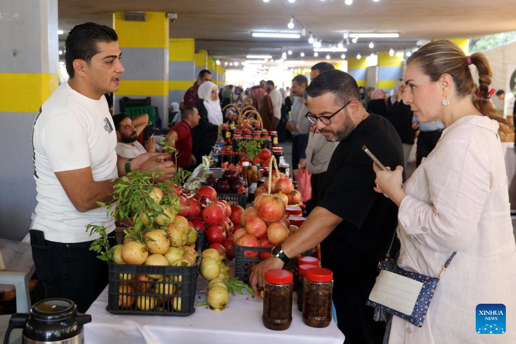 People visit the 17th Annual Pomegranate and Rural Products Festival in Irbid, Jordan, Oct. 23, 2025. The festival kicked off here on Thursday. (Photo by Mohammad Abu Ghosh/Xinhua)
