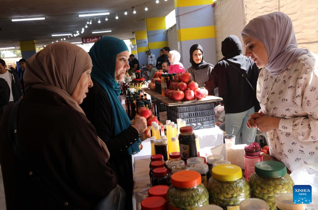 People visit the 17th Annual Pomegranate and Rural Products Festival in Irbid, Jordan, Oct. 23, 2025. The festival kicked off here on Thursday. (Photo by Mohammad Abu Ghosh/Xinhua)