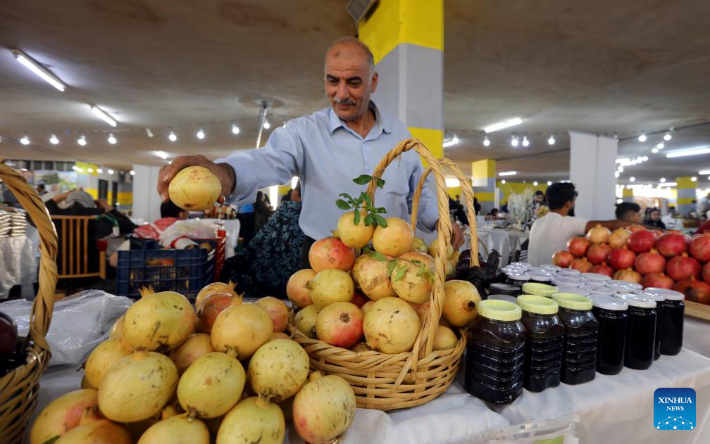 This photo taken on Oct. 23, 2025 shows a booth at the 17th Annual Pomegranate and Rural Products Festival in Irbid, Jordan. The festival kicked off here on Thursday. (Photo by Mohammad Abu Ghosh/Xinhua)
