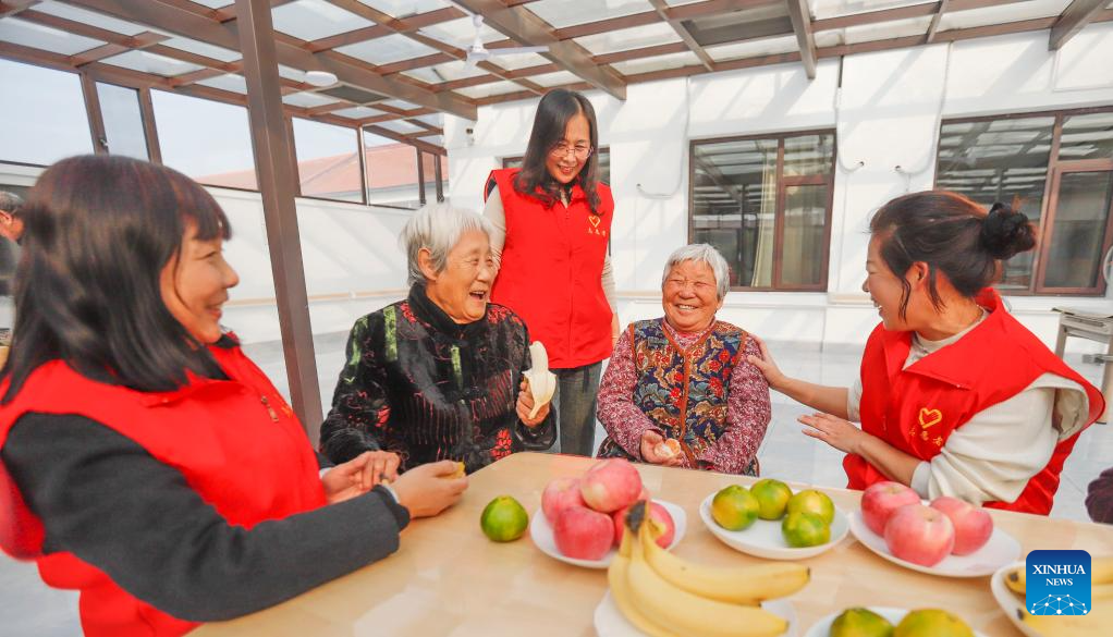 Volunteers chat with elderly people at a nursing home in Zhanggezhuang Village of Zunhua City, north China's Hebei Province, Oct. 28, 2025. A series of activities were held across the country to mark China's Chongyang Festival, which will fall on Oct. 29 this year. Also known as Seniors' Day in China nowadays, it highlights the public's care for elderly people. (Photo by Liu Mancang/Xinhua)