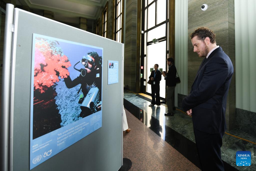People visit the photo exhibition Shared Lives, Shared Future at the Palais des Nations in Geneva, Switzerland, Oct. 24, 2025. A photo exhibition titled Shared Lives, Shared Future commemorating the 80th anniversary of the United Nations was opened here at the Palais des Nations on Friday, which coincided with United Nations Day. The exhibition presented 27 stories showing the United Nations made a difference in people's daily lives, from advancing peace and security to providing humanitarian aid. (Photo: Xinhua)