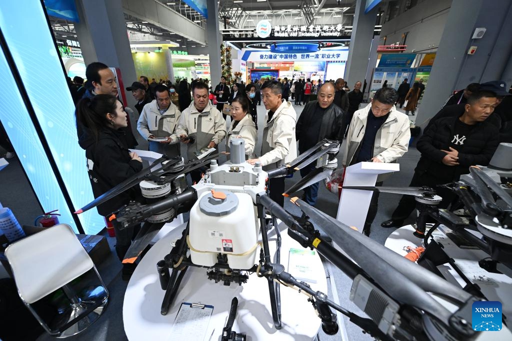 Visitors learn about agricultural drones at the 32nd China Yangling Agricultural Hi-tech Fair in Yangling, northwest China's Shaanxi Province, Oct. 25, 2025. Featuring innovations in agricultural high-tech achievements, the 32nd China Yangling Agricultural Hi-tech Fair kicked off here on Saturday. (Photo: Xinhua)
