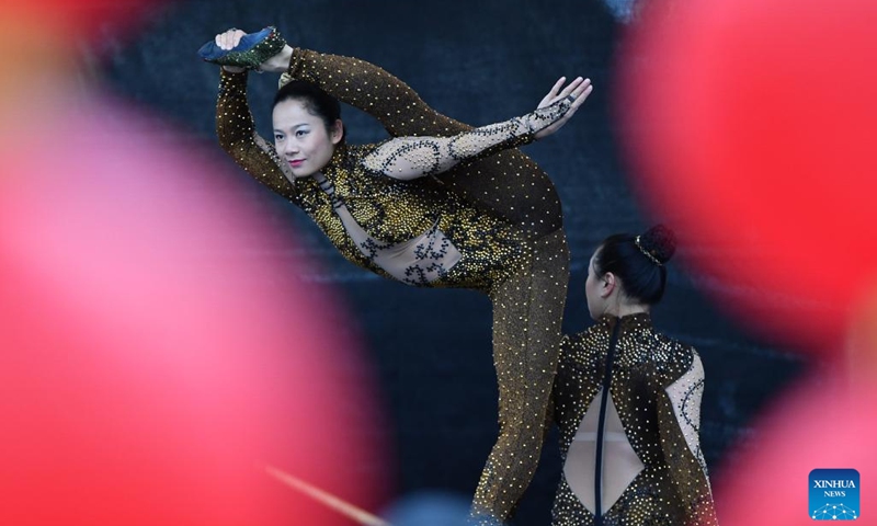 Actresses perform acrobatics during the Meet China cultural festival at Waisenhaus Square in Bern, the capital of Switzerland, Oct. 25, 2025. The festival was held here on Saturday to celebrate the 75th anniversary of the establishment of diplomatic relations between China and Switzerland and the 76th anniversary of the founding of the People's Republic of China. It spotlighted a variety of performances including Chinese martial arts, acrobatics, and Swiss alpine horn, as well as about 20 cultural experiences such as sachet making and lacquer fan crafting. (Photo: Xinhua)
