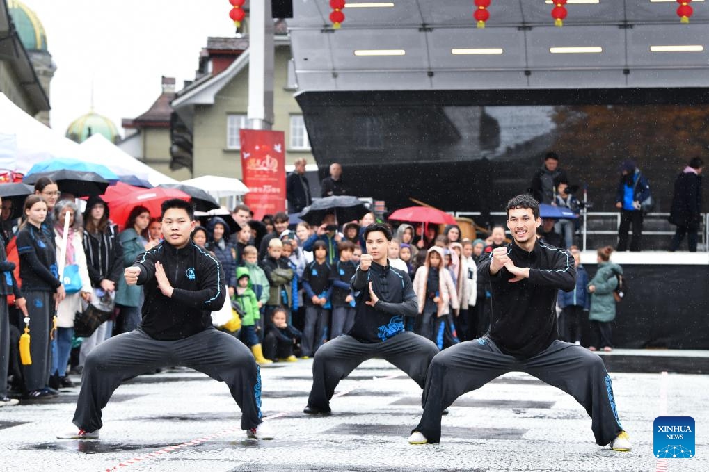 People perform Chinese martial arts (Kung Fu) during the Meet China cultural festival at Waisenhaus Square in Bern, the capital of Switzerland, Oct. 25, 2025. The festival was held here on Saturday to celebrate the 75th anniversary of the establishment of diplomatic relations between China and Switzerland and the 76th anniversary of the founding of the People's Republic of China. It spotlighted a variety of performances including Chinese martial arts, acrobatics, and Swiss alpine horn, as well as about 20 cultural experiences such as sachet making and lacquer fan crafting. (Photo: Xinhua)