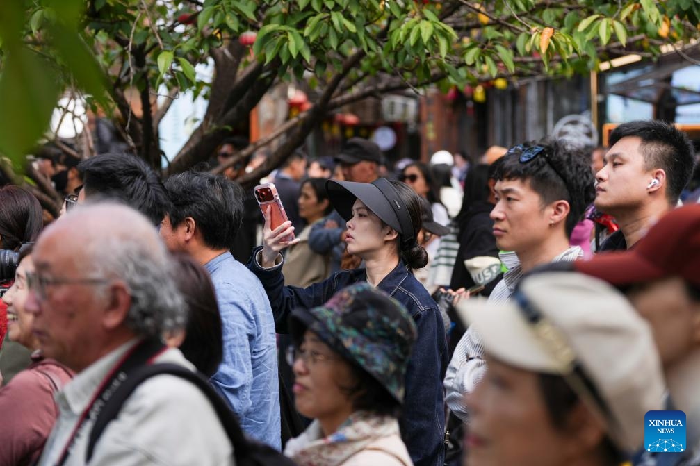Tourists watch the performances during a dance festival in the ancient town of Xinshi of Deqing County, east China's Zhejiang Province, on Oct. 24, 2025. (Photo: Xinhua)