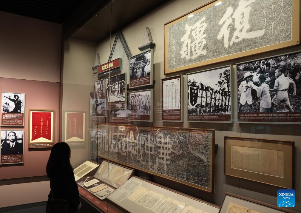 A woman visits Unyielding Treasure Island: Loyal to the Motherland, an exhibition on the history of Taiwan compatriots' resistance against Japanese aggression, at the Museum of the War of Chinese People's Resistance Against Japanese Aggression in Beijing, capital of China, Oct. 25, 2025. Featuring 387 archive photographs and 453 cultural relics, the exhibition opened here on Saturday to commemorate the 80th anniversary of Taiwan's restoration to China. (Photo: Xinhua)