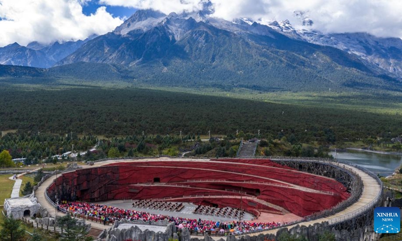 An aerial drone photo taken on Oct. 26, 2025 shows tourists watching a performance at the Yulong Snow Mountain scenic spot in Lijiang City, southwest China's Yunnan Province. (Photo: Xinhua)