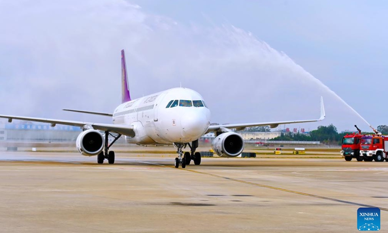 An airplane, departing from Cambodia's capital Phnom Penh, is given a water salute upon landing at the Fuzhou Changle International Airport in Fuzhou, southeast China's Fujian Province, Oct. 26, 2025. Fujian's first flight granted the Fifth Freedom of the Air, the Phnom Penh-Fuzhou-Tokyo route, was officially launched on Sunday. The Fifth Freedom of the Air refers to the right granted to an airline of one country to make a stopover in a third country while operating an international route, allowing it to load and unload passengers and cargo there. (Photo: Xinhua)