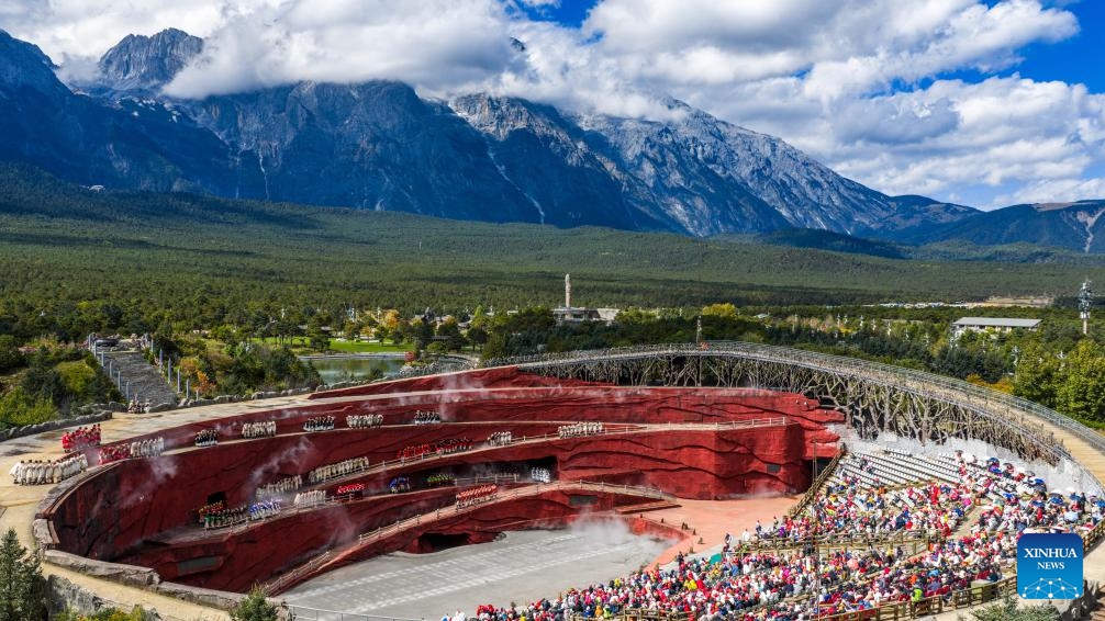 An aerial drone photo taken on Oct. 26, 2025 shows tourists watching a performance at the Yulong Snow Mountain scenic spot in Lijiang City, southwest China's Yunnan Province. (Photo: Xinhua)