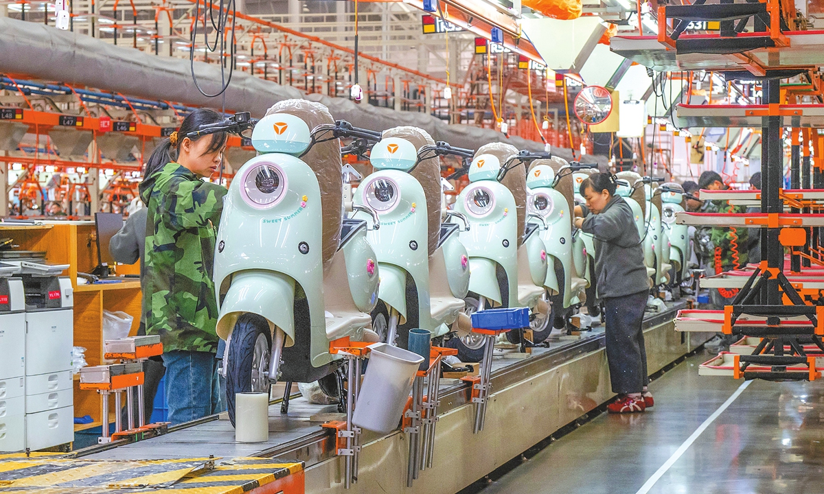 Workers assemble E-bikes on a production line at China-based manufacturer Yadea in Jinzhai, Lu'an, East China's Anhui Province, on October 28, 2025. Photo: VCG