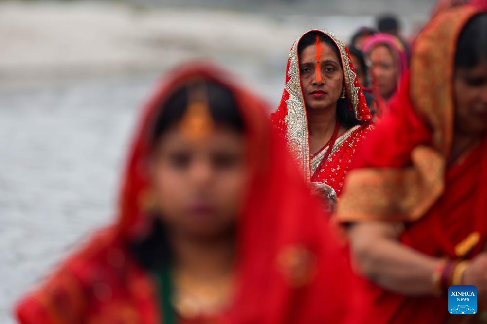 Hindu devotees offer prayers to the setting sun on the occasion of the Chhath festival in Kathmandu, Nepal, Oct. 27, 2025. The Chhath festival is dedicated to the sun with Hindu devotees making offerings to the setting and rising sun. (Photo: Xinhua)