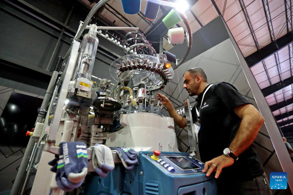 This photo taken on Oct. 29, 2025 shows an exhibitor showcasing textile craftsmanship at the Lebanese Industry Expo 2025 in Beirut, Lebanon. The expo, which takes place in Beirut from Oct. 29 to Nov. 1, aims to bring together leaders, innovators, and stakeholders from across Lebanon's industrial sector to showcase products, exchange ideas, and explore new opportunities. (Xinhua/Bilal Jawich)