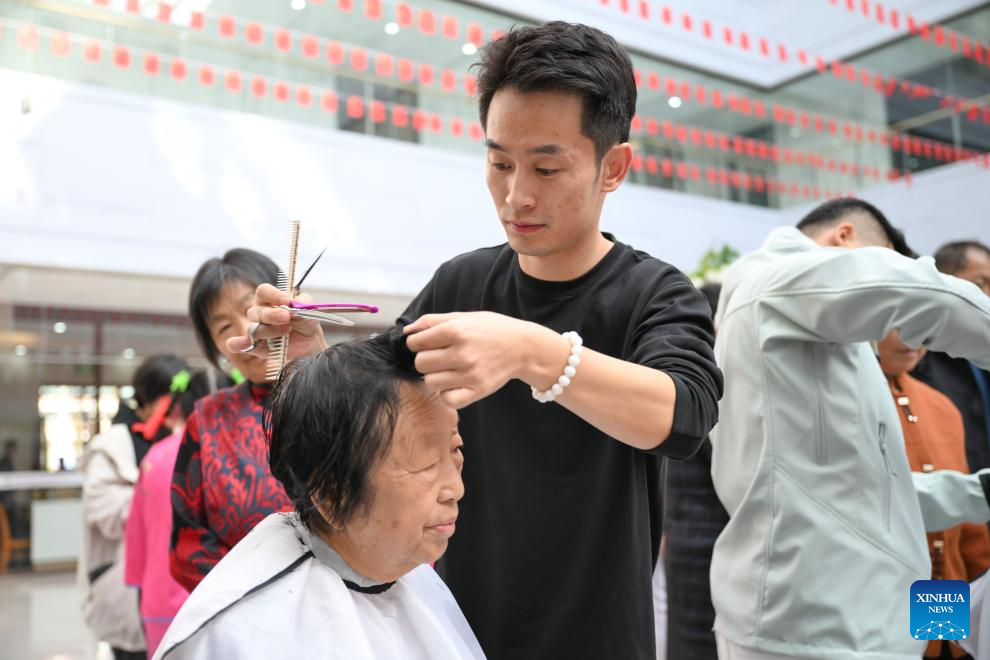 A barber provides free service for an aged resident at a community in Erdos, north China's Inner Mongolia Autonomous Region, Oct. 29, 2025. The Double Ninth Festival, also known as the Chongyang Festival, celebrated on the ninth day of the ninth lunar month, falls on Wednesday this year. It is an occasion to care for and send blessings to older people in China. (Xinhua/Bei He)