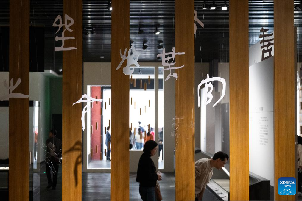 People visit the exhibition Ancient Chinese Bamboo and Wooden Slips at the Hubei Provincial Museum in Wuhan, central China's Hubei Province, Oct. 28, 2025.

Featuring 230 pieces (sets) of bamboo and wooden slips from multiple historical periods, the exhibition opened here on Tuesday.

Bamboo and wooden slips, each containing a narrow vertical column of dozens of characters, can be classified as China's earliest form of books. They used to be the most important objects to write on before paper was invented. (Xinhua/Xiao Yijiu)