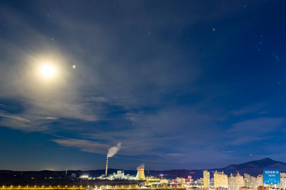 This photo taken on Nov. 10, 2025 shows a celestial scene where the moon is accompanied by Jupiter and Pollux, the brightest star in the constellation Gemini, in Shuangyashan City, northeast China's Heilongjiang Province. (Photo by Han Yang/Xinhua)