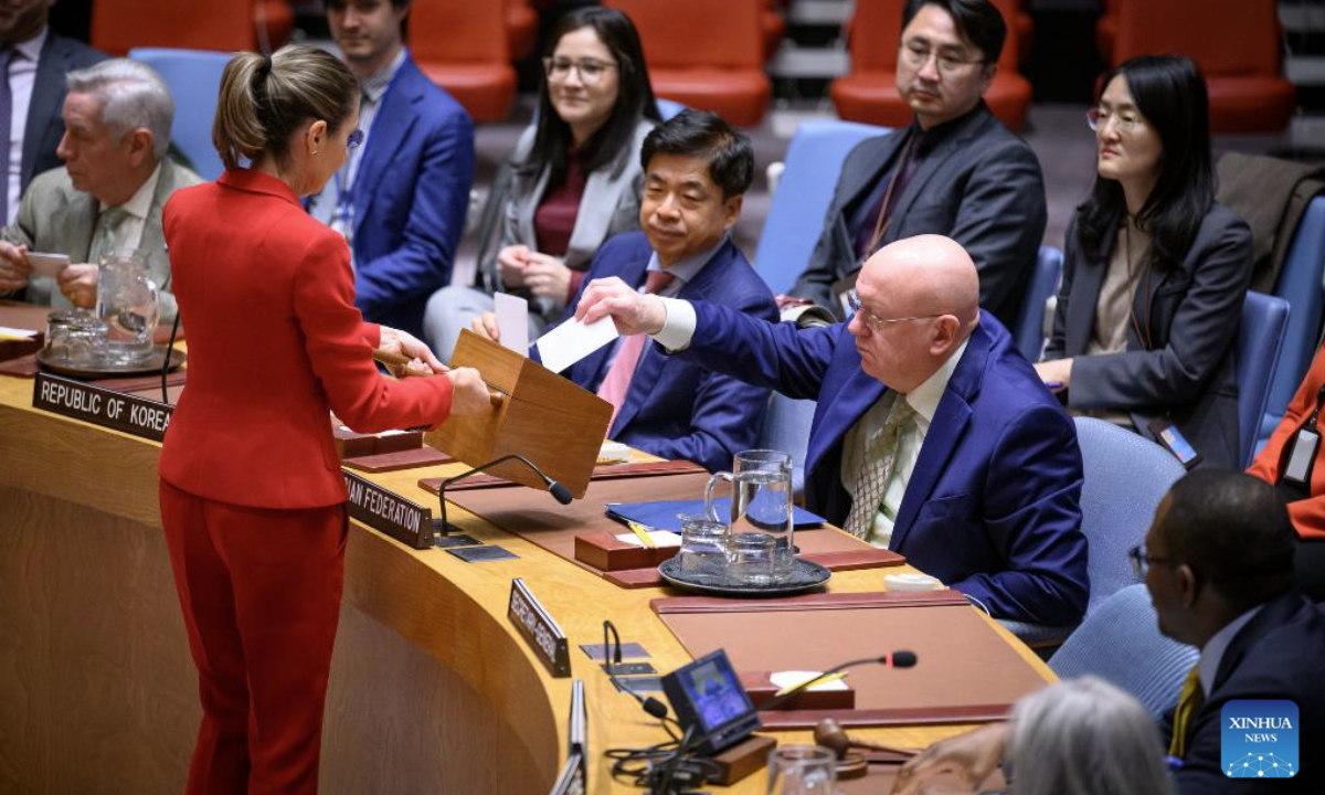 A conference officer (woman in red) collects ballots during a Security Council meeting to elect a judge for the International Court of Justice at the UN headquarters in New York, Nov. 12, 2025. Kenyan jurist Phoebe Okowa was elected a judge of the International Court of Justice (ICJ) on Wednesday to fill the seat vacated by Somalia's Abdulqawi Yusuf, who resigned effective Sept. 30. Under the ICJ's Statute, judges are elected by secret ballot in both the Security Council and the General Assembly. (Loey Felipe/UN Photo/Handout via Xinhua)