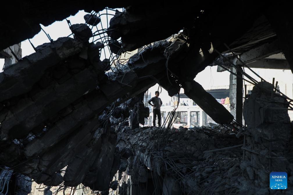 A Palestinian inspects the destroyed houses after Israeli airstrikes in Al-Zeitoun neighborhood east of Gaza City, Nov. 20, 2025. (Photo by Rizek Abdeljawad/Xinhua)