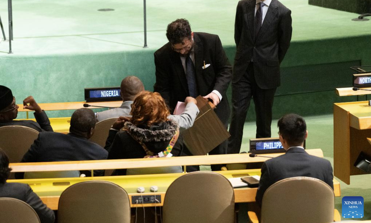 A conference officer (2nd R) collects ballots during a General Assembly meeting to elect a judge for the International Court of Justice at the UN headquarters in New York, Nov. 12, 2025. Kenyan jurist Phoebe Okowa was elected a judge of the International Court of Justice (ICJ) on Wednesday to fill the seat vacated by Somalia's Abdulqawi Yusuf, who resigned effective Sept. 30. Under the ICJ's Statute, judges are elected by secret ballot in both the Security Council and the General Assembly. (Evan Schneider/UN Photo/Handout via Xinhua)