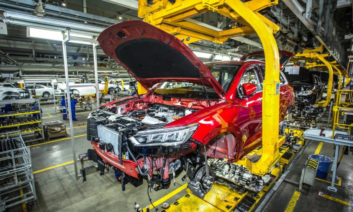 This undated photo shows a production line of new energy vehicles (NEVs) of BYD in Shenzhen, south China's Guangdong Province. (BYD/Handout via Xinhua)