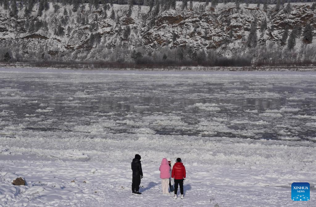 Tourists enjoy the scenery of ice flow on the Mohe section of the Heilongjiang River in northeast China's Heilongjiang Province, on Nov. 11, 2025. (Photo by Liang Zhiqiang/Xinhua)