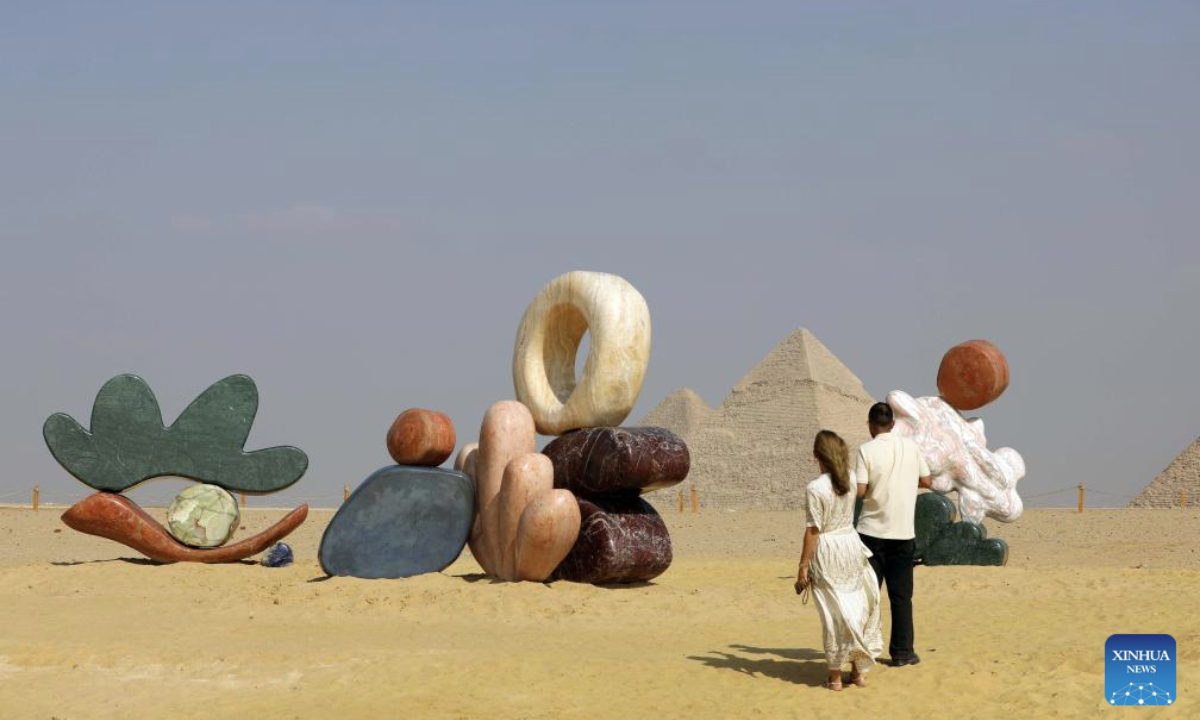 An artistic installation is displayed during the Forever Is Now international art exhibition at Giza Pyramids scenic spot in Giza, Egypt, Nov. 11, 2025. The fifth edition of Forever Is Now international art exhibition on Tuesday kicked off in the area of Egypt's Giza Pyramids scenic spot, showcasing 10 artworks of artists from different countries. The exhibition runs from Nov. 11 to Dec. 6. (Xinhua/Ahmed Gomaa)