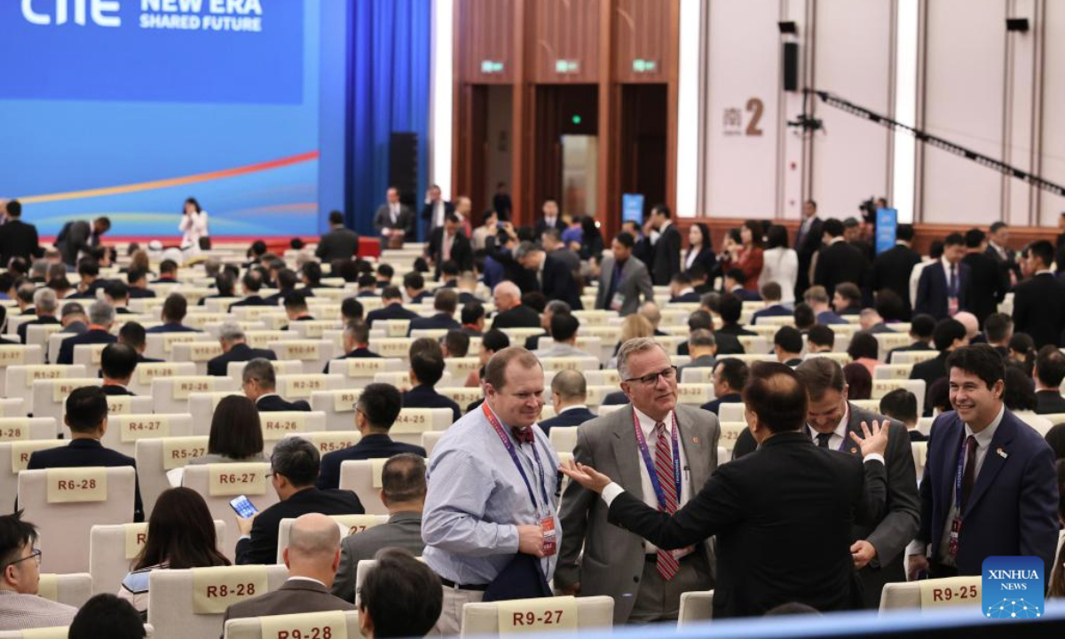 Guests talk at the venue of the opening ceremony of the eighth China International Import Expo (CIIE) and the Hongqiao International Economic Forum in Shanghai, east China, Nov. 5, 2025.

The eighth CIIE and Hongqiao International Economic Forum opened here on Wednesday. (Xinhua/Fang Zhe)