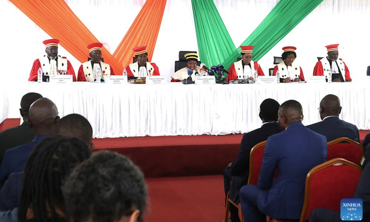 President of Cote d'Ivoire's Constitutional Council Chantal Camara (C) declares Alassane Ouattara as the winner of the presidential election held on Oct. 25 during a ceremony in Abidjan, Cote d'Ivoire, on Nov. 4, 2025. (Photo by Yvan Sonh/Xinhua)