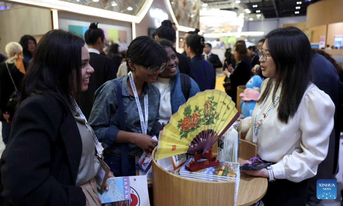 People talk at the China pavilion of the World Travel Market (WTM) London 2025 in London, Britain, Nov. 4, 2025. The WTM London 2025 opened on Tuesday, with the China pavilion drawing attention for its abundant tourism resources and cultural appeal. (Xinhua/Li Ying)