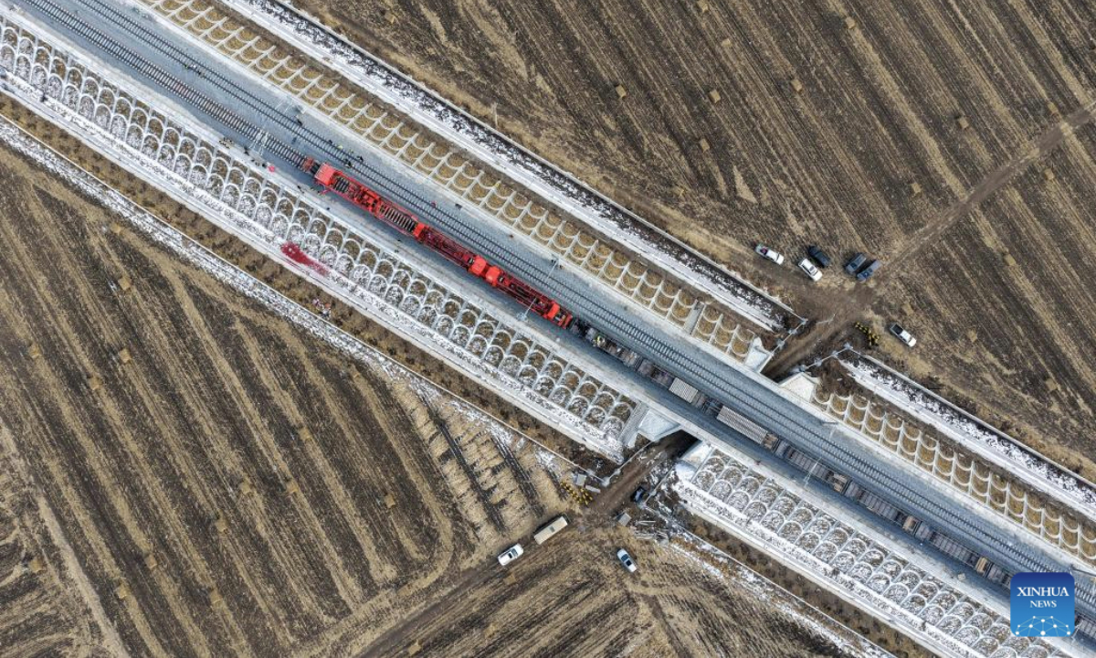An aerial drone photo taken on Nov. 25, 2025 shows a construction site of the Harbin-Yichun high-speed railway in Qing'an County, northeast China's Heilongjiang Province. Track-laying for the Harbin-Yichun high-speed railway completed on Tuesday. The Harbin-Yichun high-speed railway is China's northernmost high-speed railway under construction. (Xinhua/Wang Song)