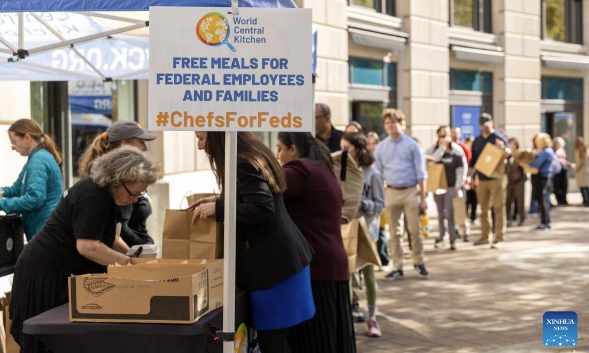 Federal employees receive free meals at a free food distribution stall in Washington, D.C., the United States, Nov. 5, 2025. On Wednesday, the U.S. federal government shutdown entered its 36th day, surpassing the previous 35-day record set during the 2018-2019 shutdown, making it the longest government shutdown in U.S. history. (Xinhua/Hu Yousong)