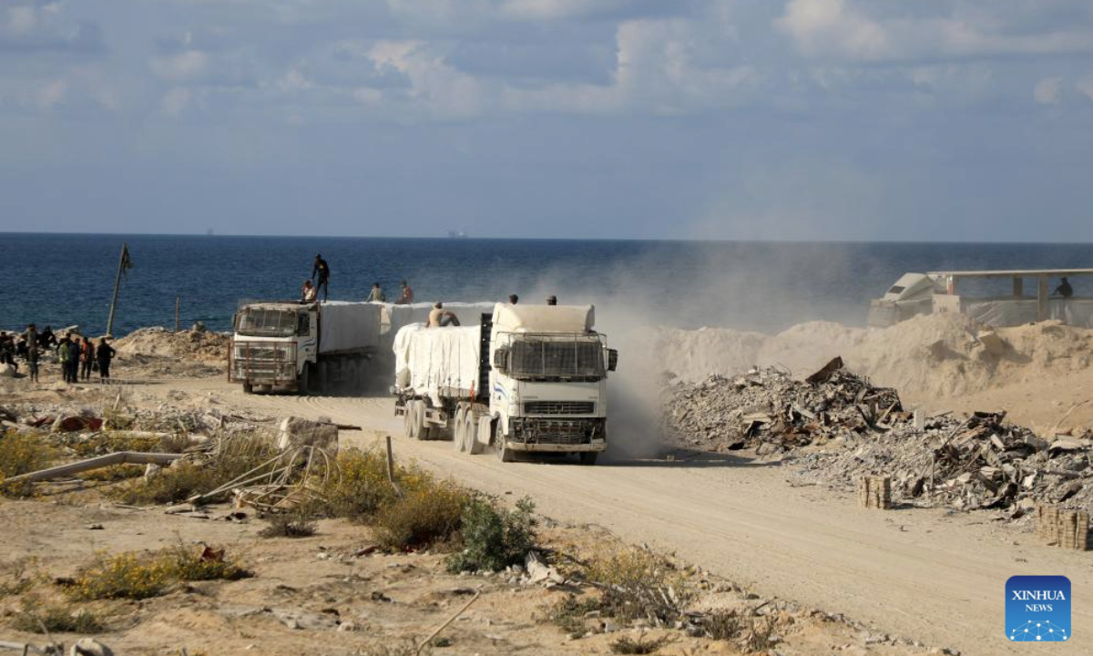 Photo taken on Nov. 13, 2025 shows trucks that carry commercial goods and enter through the Zikim crossing in northern Gaza Strip. Israel said on Wednesday it has reopened the Zikim crossing to allow humanitarian aid trucks into northern Gaza. (Photo by Rizek Abdeljawad/Xinhua)