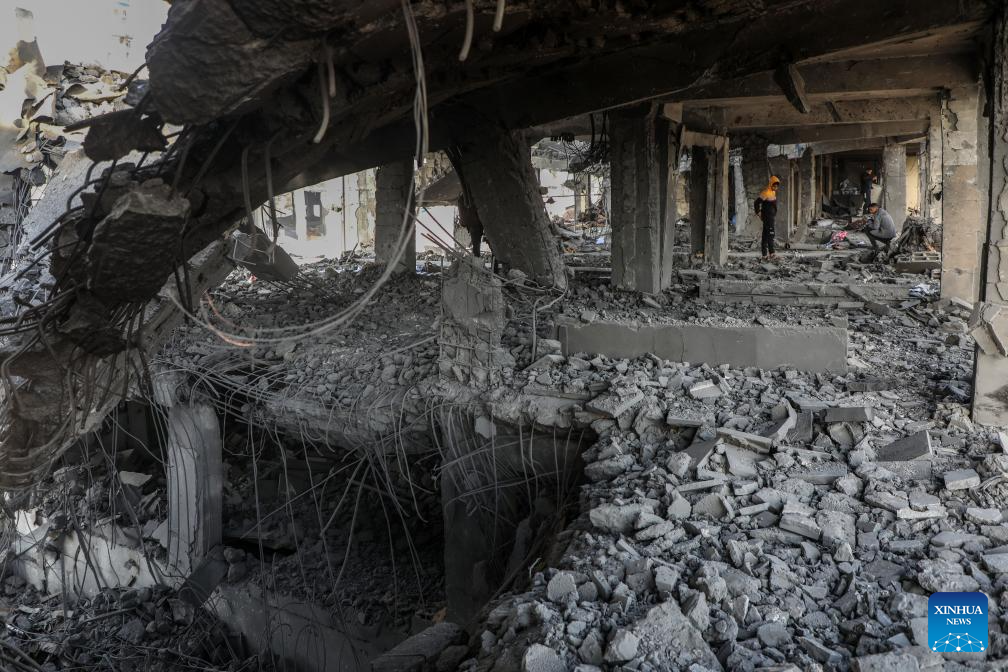 Palestinians inspect the destroyed houses after Israeli airstrikes in Al-Zeitoun neighborhood east of Gaza City, Nov. 20, 2025. (Photo by Rizek Abdeljawad/Xinhua)