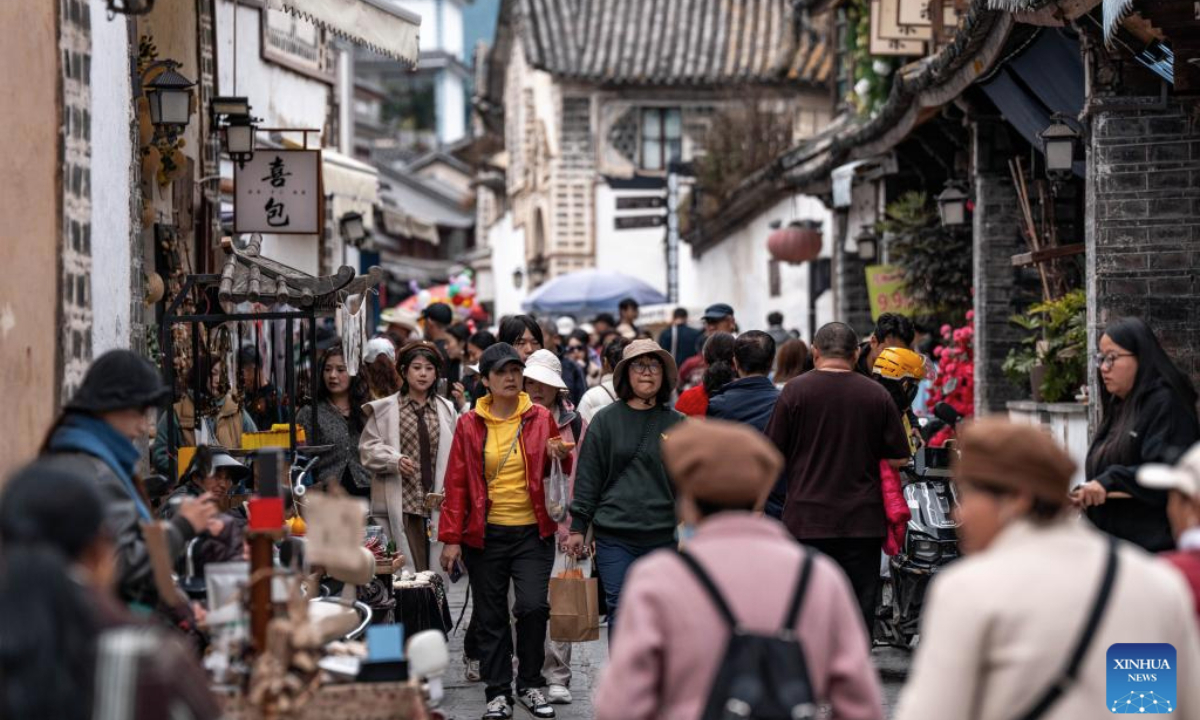 Tourists visit Xizhou old town in Dali City, southwest China's Yunnan Province, Nov. 24, 2025. (Xinhua/Hu Chao)