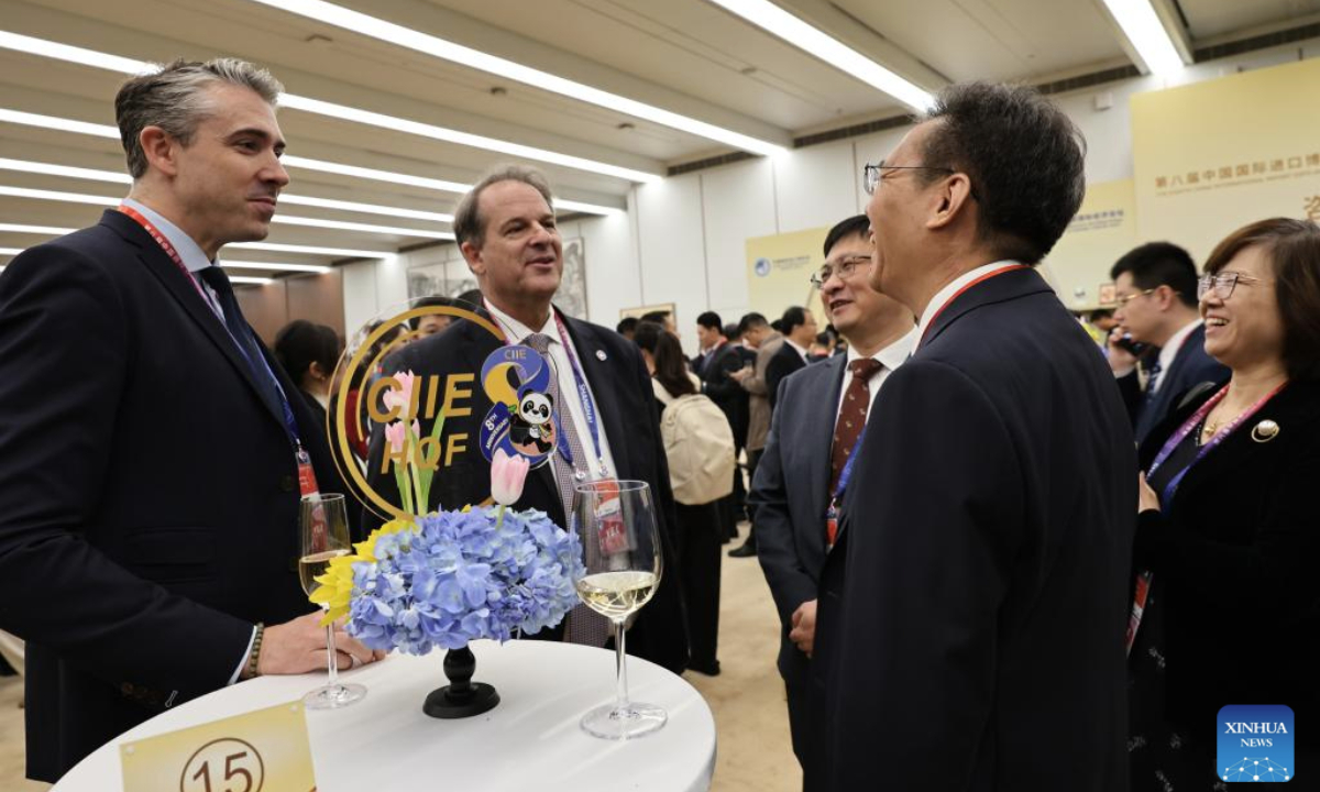 Guests talk at the venue of the opening ceremony of the eighth China International Import Expo (CIIE) and the Hongqiao International Economic Forum in Shanghai, east China, Nov. 5, 2025.

The eighth CIIE and Hongqiao International Economic Forum opened here on Wednesday. (Xinhua/Fang Zhe)