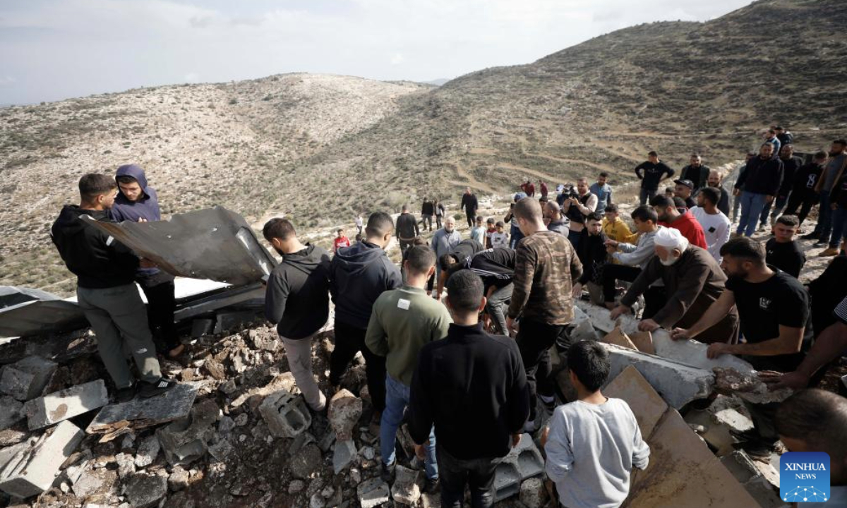 Palestinians inspect the damage at the site where a Palestinian man was killed in the Marka area south of Jenin in the West Bank, Nov. 25, 2025. (Photo by Nidal Eshtayeh/Xinhua)