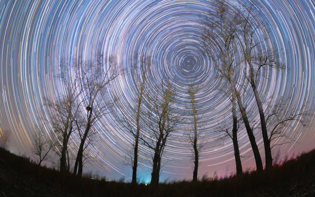 A stacked composite photo taken on Oct. 31, 2025 shows trees under the starry night sky in Fujin City, northeast China's Heilongjiang Province.

On the autumn nights, quiet and magnificent pictures of starlight in the northernmost province of China are unfolding. (Photo by Geng Xiqing/Xinhua)