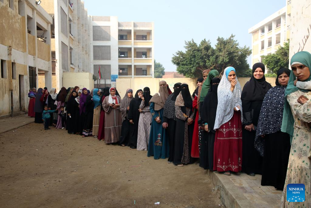 Egyptians queue up to vote at a polling station during the first phase of House of Representatives elections in Giza, Egypt, Nov. 10, 2025. Voting began on Monday in the first phase of Egypt's 2025 House of Representatives elections, which will last till Tuesday. (Photo by Mohamed Asad/Xinhua)