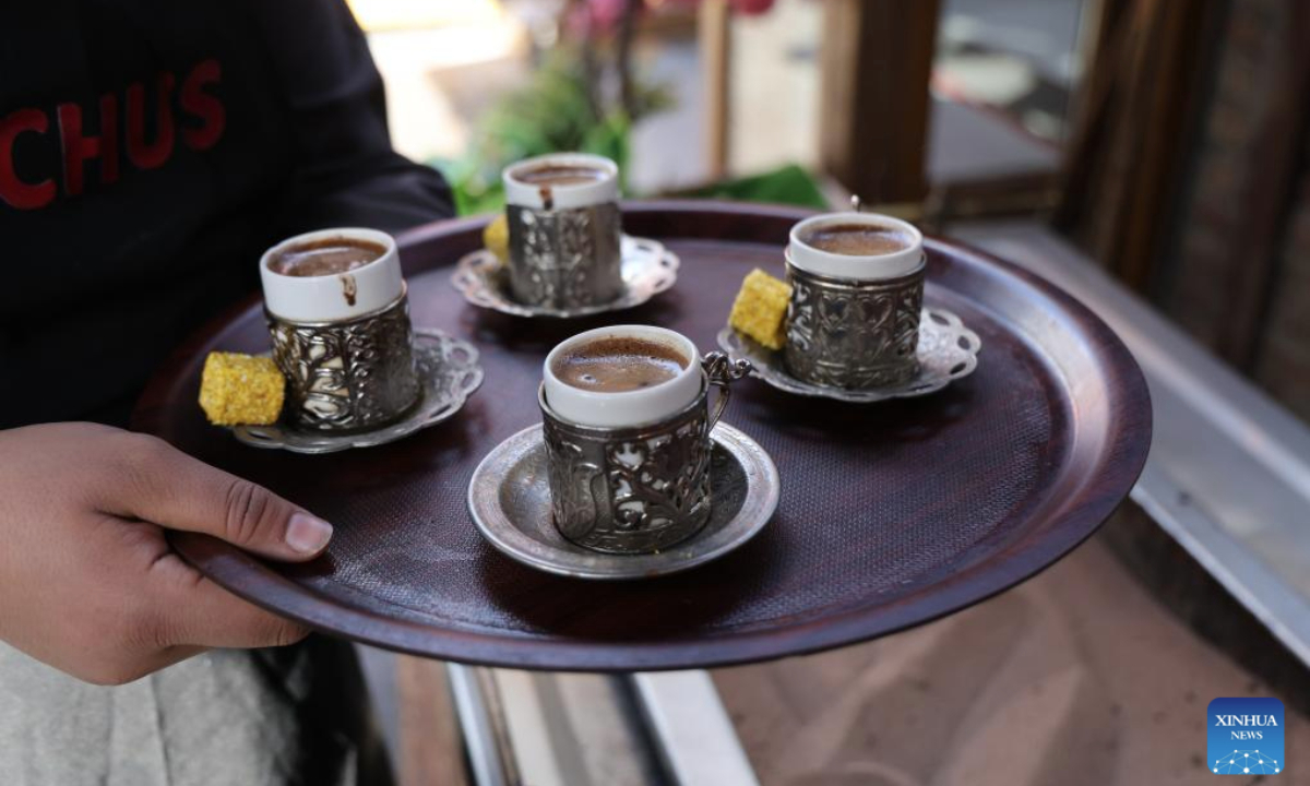 This photo taken on Nov. 12, 2025 shows the sand-brewed coffee served in small cups in Ankara, Türkiye. The brewing process of Turkish sand coffee involves little coffee pots nestling in a bed of hot sand. (Mustafa Kaya/Handout via Xinhua)