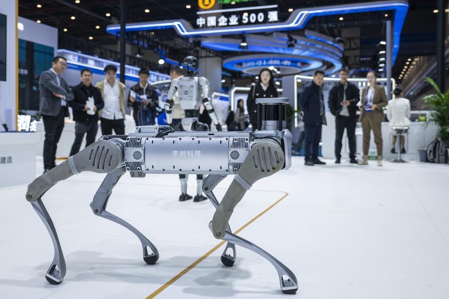 People look at a robot dog from Unitree Robotics during the 2025 International (Wuhan) Intelligent Building Industry Expo at the China Optics Valley Convention and Exhibition Center in Wuhan, central China's Hubei Province, Oct. 31, 2025. (Photo: Xinhua)
