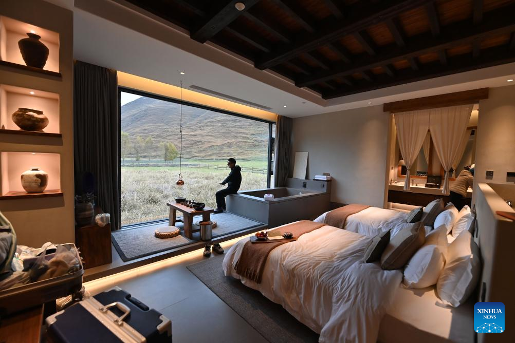 A tourist rests at a homestay in Kangding City, Ganzi Tibetan Autonomous Prefecture, southwest China's Sichuan Province, Oct. 31, 2025. In recent years, Ganzi Tibetan Autonomous Prefecture has leveraged its natural scenic advantages to develop its cultural and tourism industry. From January to October this year, the prefecture has received over 40 million tourist trips, setting a new record for the same period. (Xinhua/Xiao Xiao)