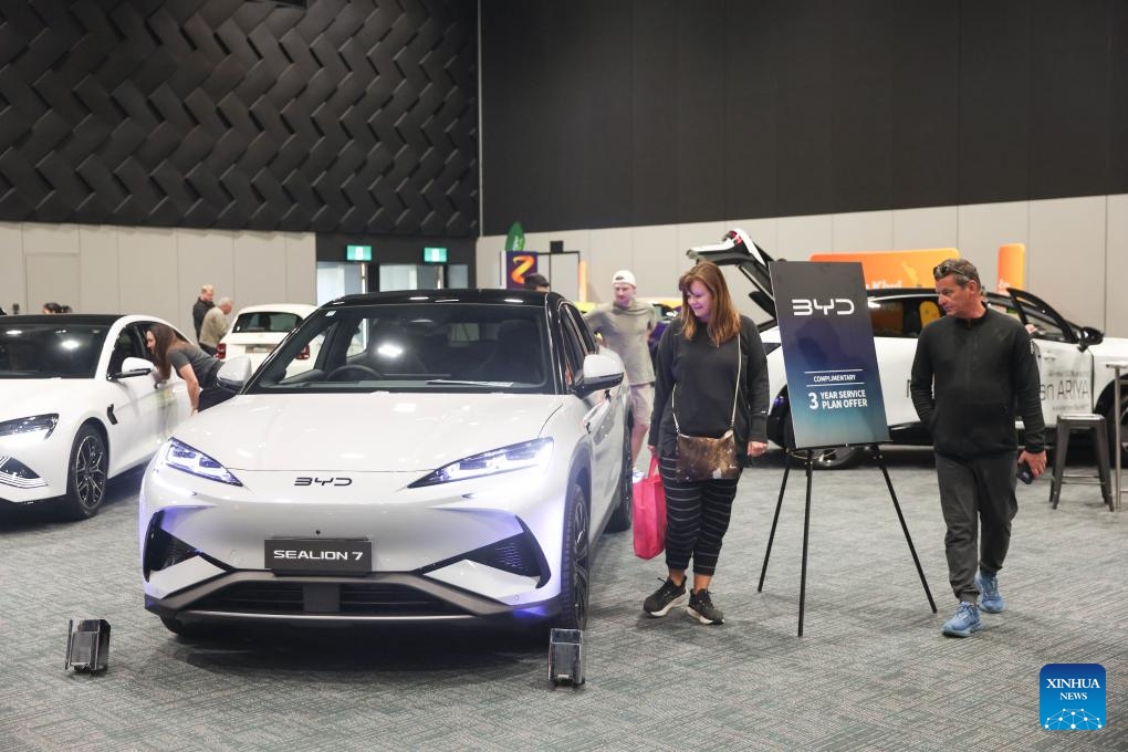 People view a Chinese BYD vehicle at the Take Charge Expo in Christchurch, New Zealand, Nov. 1, 2025. The on-going expo showcases the latest in battery electric vehicles with Chinese brands drawing attention from international buyers (Photo: Xinhua)