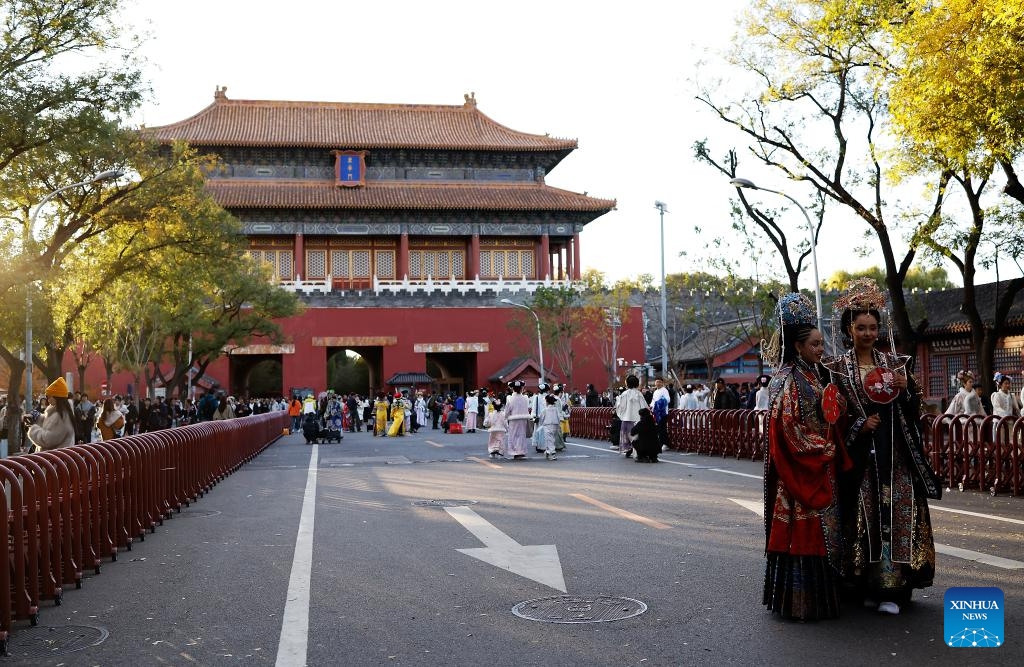 Ethiopian tourists Nuni (L front) and Betty (R front) wearing traditional Chinese costumes enjoy their photoshoot experience outside Donghua Gate,as known as East Prosperity Gate of the Palace Museum in Beijing, capital of China, Nov. 1, 2025. From January to September 2025, Beijing has received approximately 3.88 million inbound tourists, a year-on-year increase of 42.9 percent, according to Beijing Municipal Bureau of Culture and Tourism. (Photo: Xinhua)