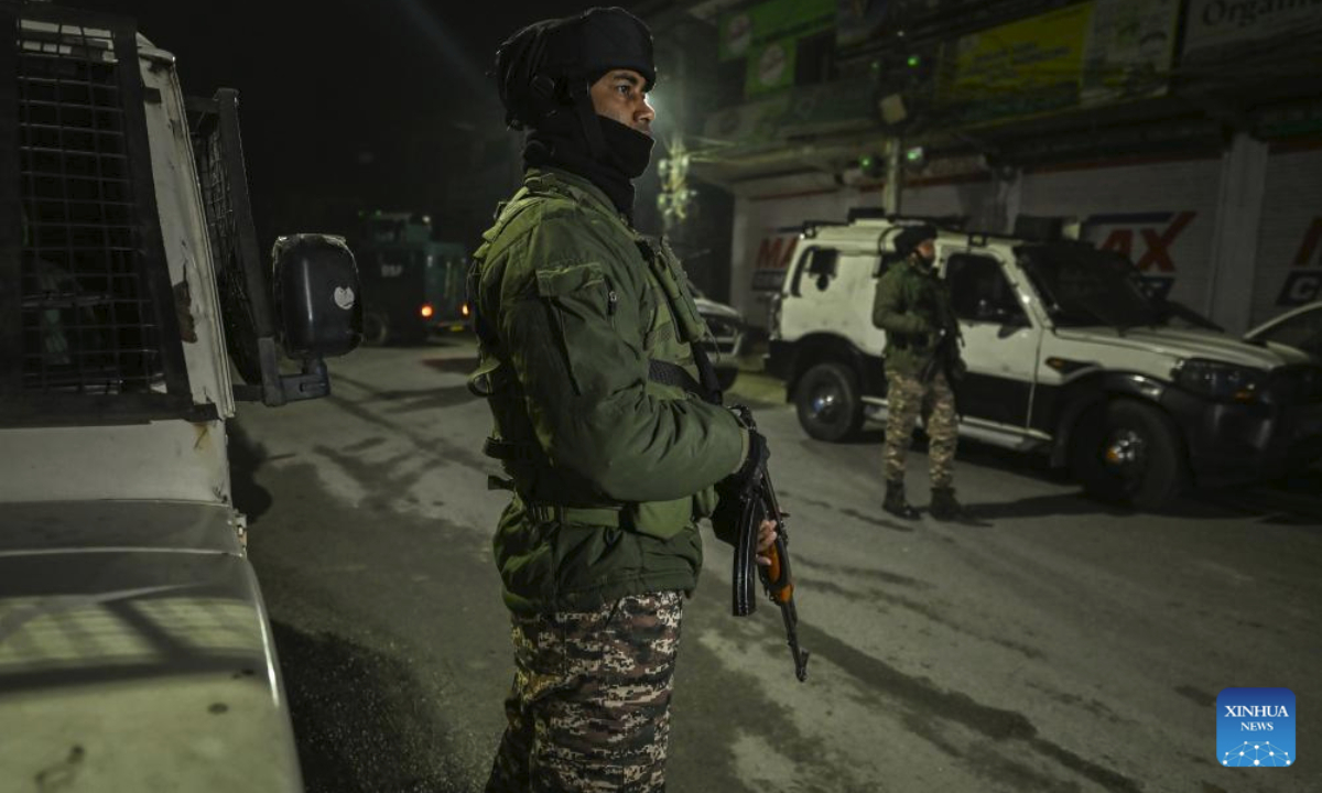 Indian paramilitary troopers stand guard near the site of an explosion inside Nowgam police station in Srinagar, the summer capital of Indian-controlled Kashmir, Nov. 15, 2025. (Xinhua/Javed Dar)