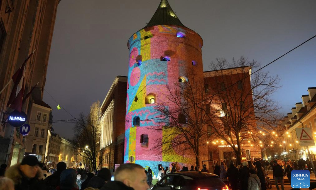 People view a light show at Powder tower during the light festival Staro Riga 2025 in Riga, Latvia, Nov. 17, 2025. (Photo by Edijs Palens/Xinhua)