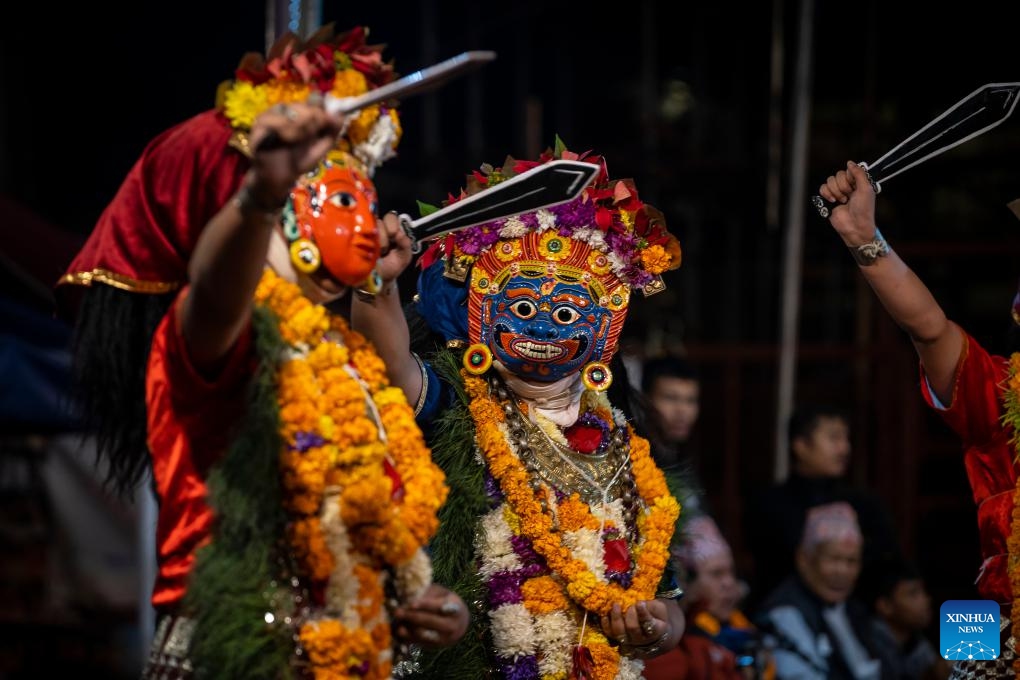 Masked dancers perform during the Kartik Naach Festival on the premises of Patan Durbar Square in Lalitpur, Nepal, Oct. 31, 2025. The Kartik Naach festival is held annually in the Hindu lunar calendar month of Kartik, showcasing traditional dance dramas based on Hindu epics. (Photo: Xinhua)